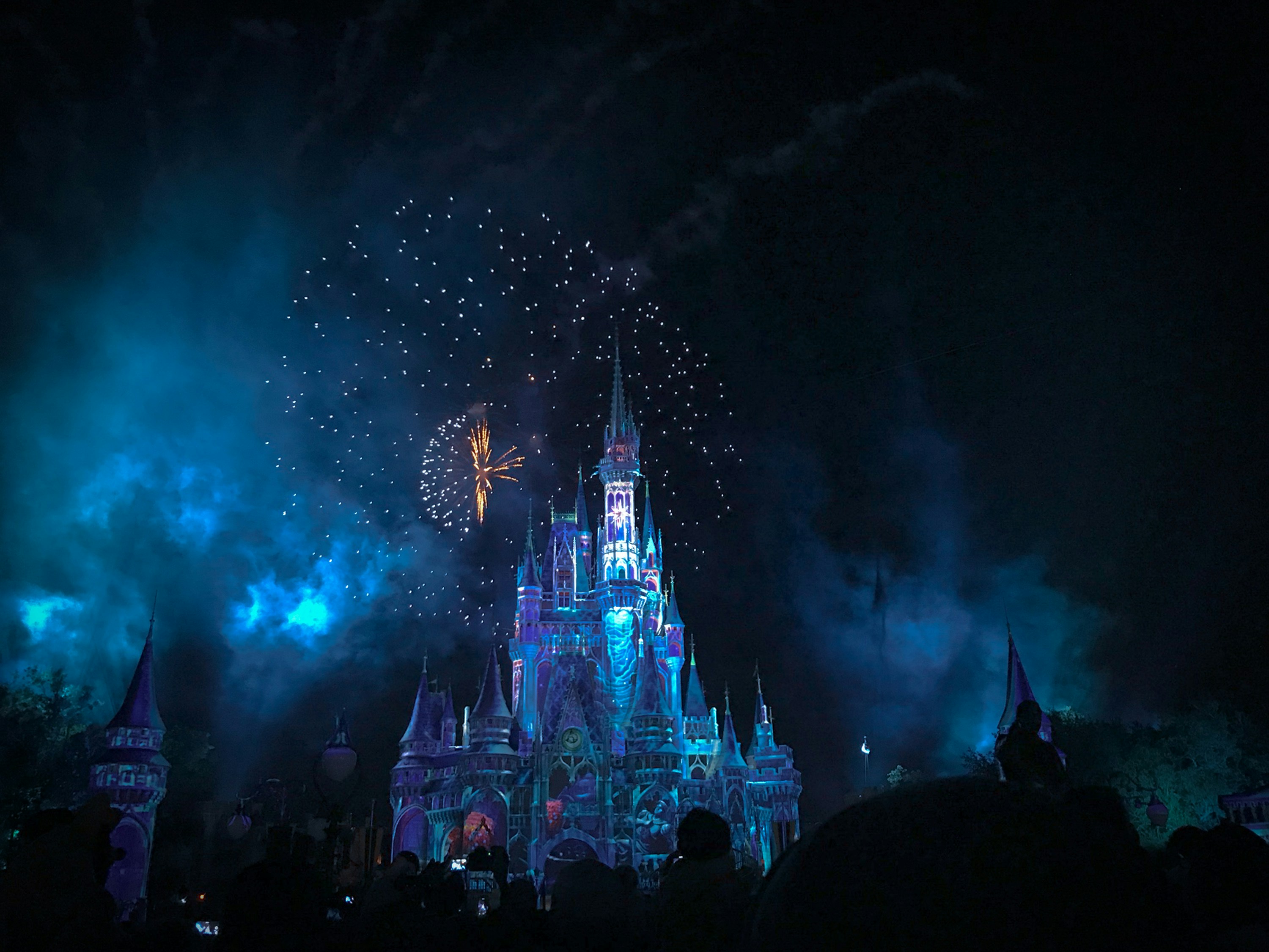 crystal castle with fireworks at night